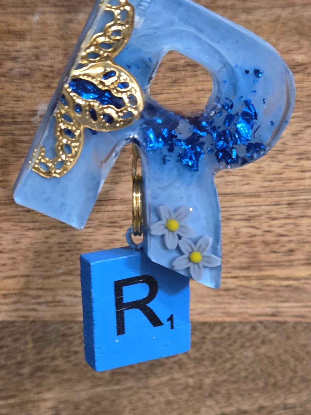Golden Accented Blue Resin 'R' Keychain Charm with Scrabble Tile & Daisies